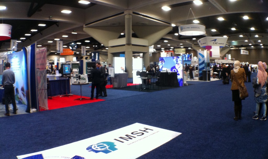 A photo of the Exhibit hall, with the IMSH sign in the foreground.